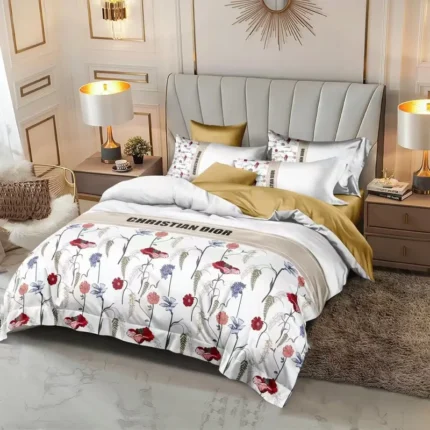 White bedding featuring a red and pink floral print with green leaves.